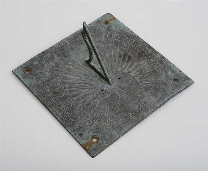 Appraisal: ENGLISH BRONZE SUNDIAL The plate engraved with a sun face