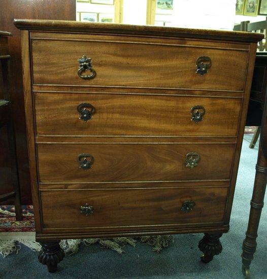 Appraisal: A mahogany cupboard enclosed by a false four drawer front