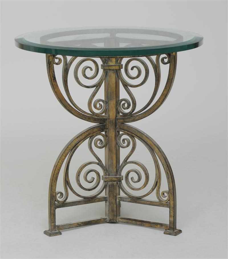 Appraisal: FRENCH GILT-METAL AND GLASS LOW TABLE With a circular glass