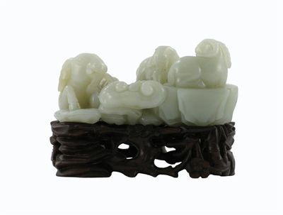 Appraisal: A Chinese pale celadon jade carving of three goats recumbent