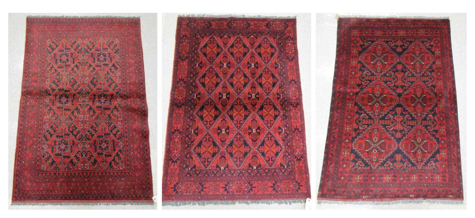 Appraisal: THREE AFGHAN BELOUCH AREA RUGS both geometric design in shades