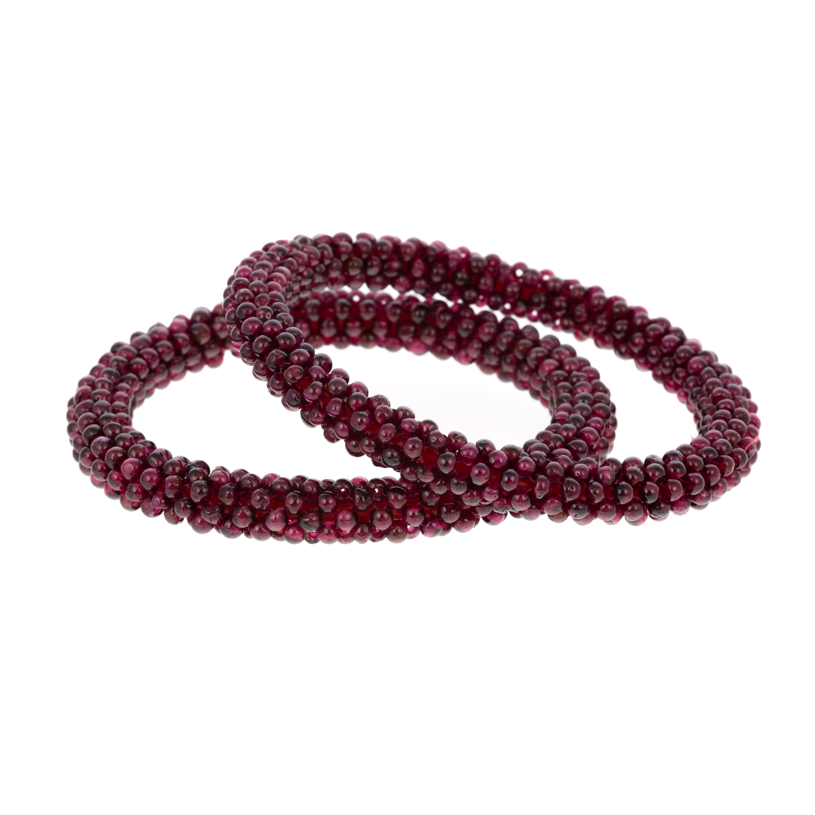 Appraisal: A PAIR OF BEADED GARNET BANGLES Two beaded garnet slip