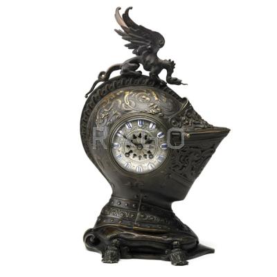 Appraisal: BRONZE HELMET CLOCK Surmounted by a gryphon th th c