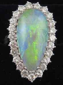 Appraisal: A hallmarked carat white gold opal and diamond ring the