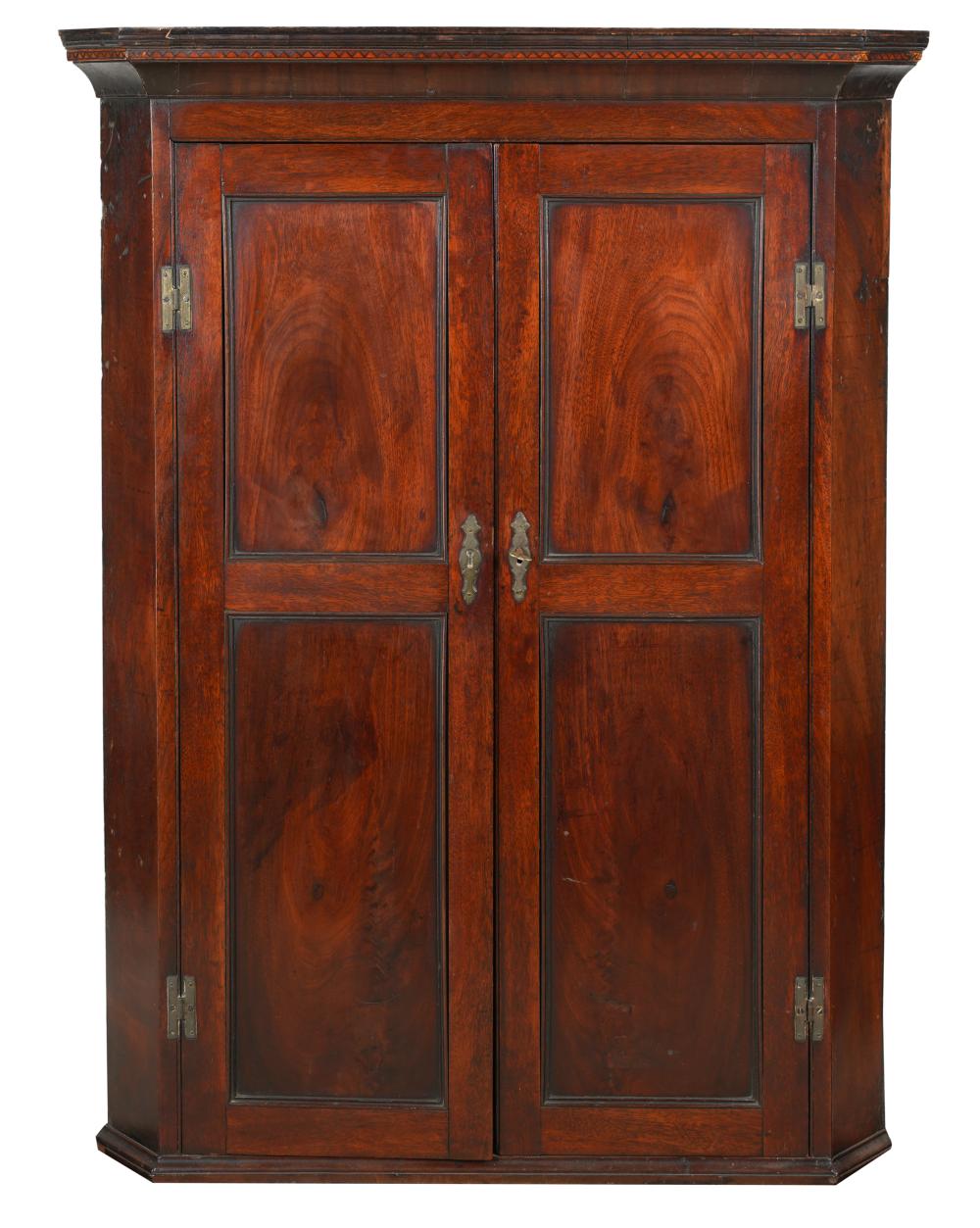 Appraisal: MAHOGANY HANGING CORNER CABINETsecond half th century the hinged doors