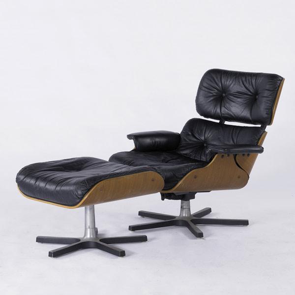 Appraisal: STYLE OF EAMES Lounge chair and ottoman upholstered in black