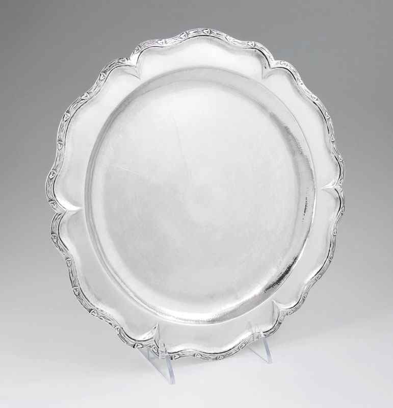 Appraisal: CONTINENTAL SILVER SALVER Embossed floral motif rim unknown makers hallmark