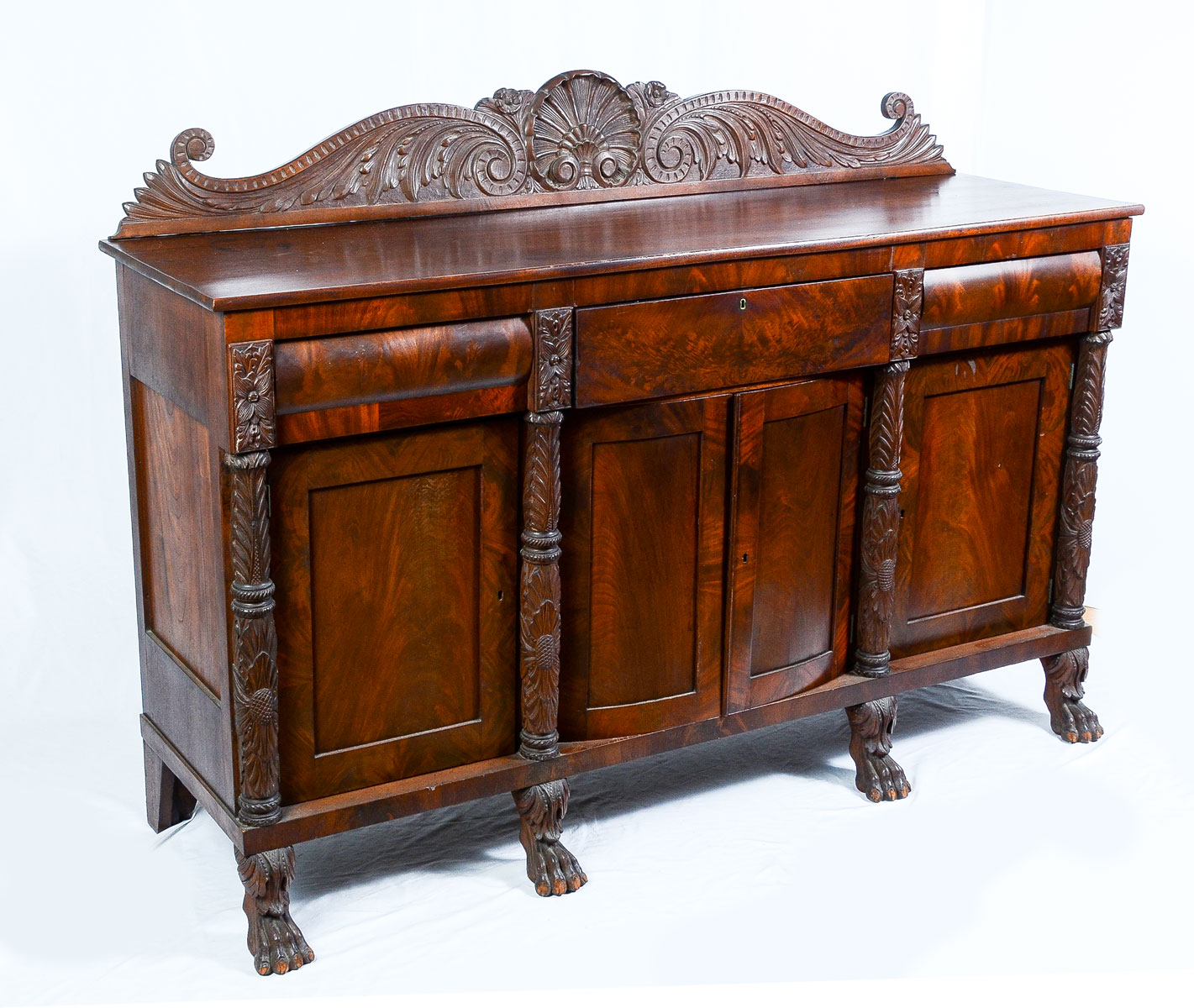 Appraisal: CARVED EMPIRE PERIOD PAW-FOOT SIDEBOARD Surmounting carved shell medallion scrolling