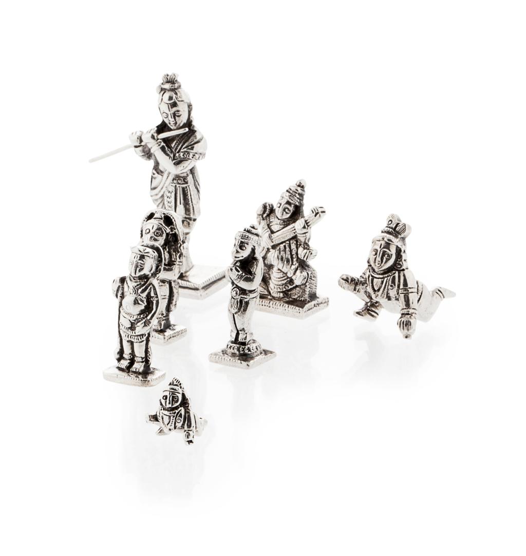 Appraisal: A group of seven cast white metal figures depicting various