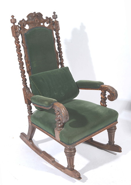 Appraisal: A VICTORIAN OAK ROCKING CHAIR with pierced and carved cresting