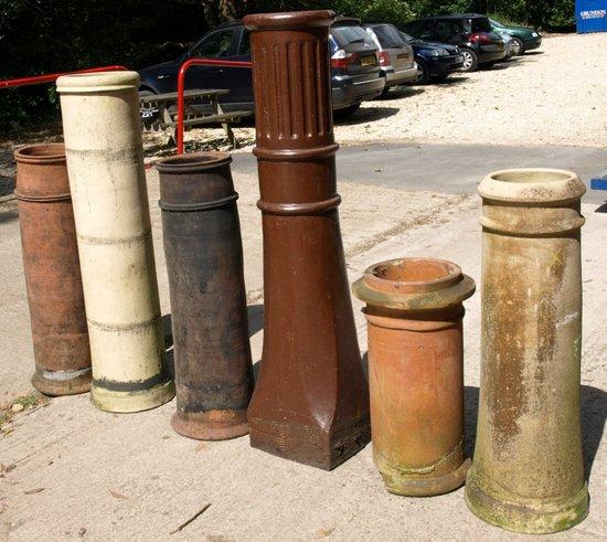 Appraisal: A tall glazed stoneware chimney pot together with five sundry