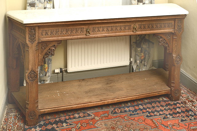 Appraisal: A VICTORIAN CARVED OAK GOTHIC REVIVAL SIDE TABLE by Crace