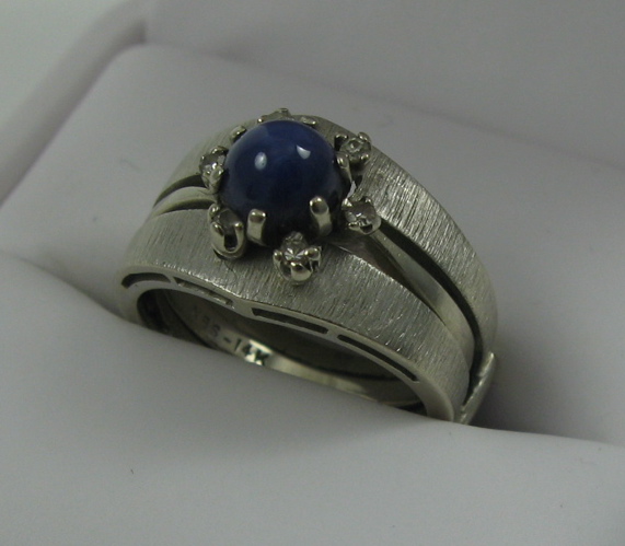 Appraisal: LINDI STAR SAPPHIRE AND DIAMOND RING The k white gold