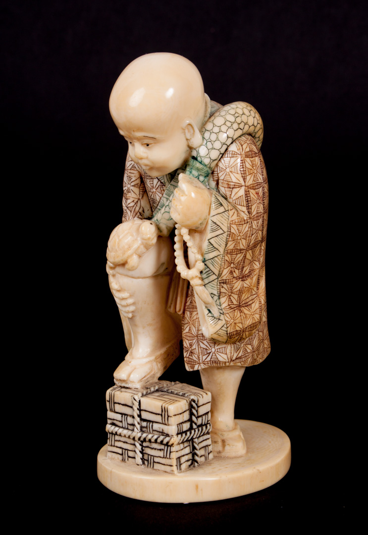 Appraisal: Chinese carved ivory figure of young Buddhist monk modeled as