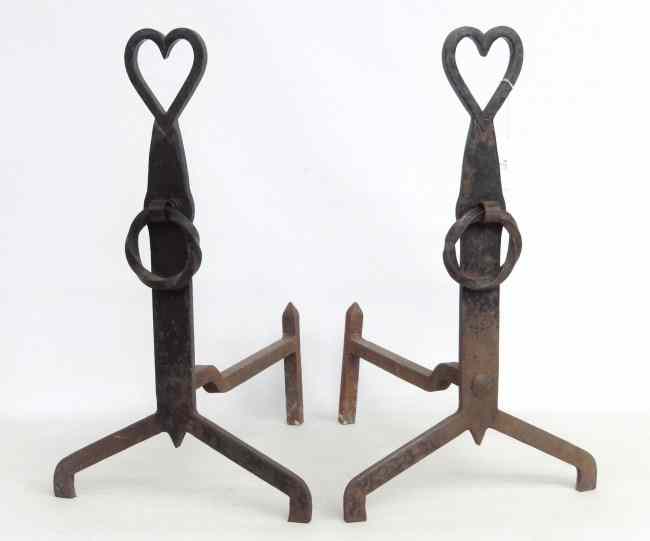 Appraisal: Pair cast iron blacksmith made heart shaped andirons '' Ht