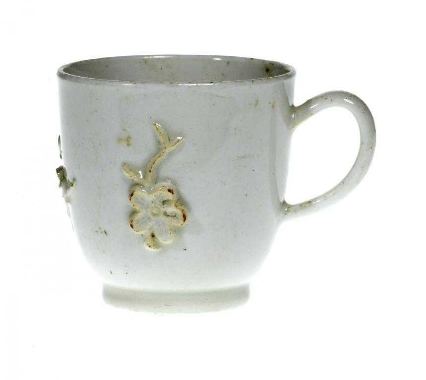 Appraisal: A DERBY WHITE COFFEE CUP with loop handle and moulded