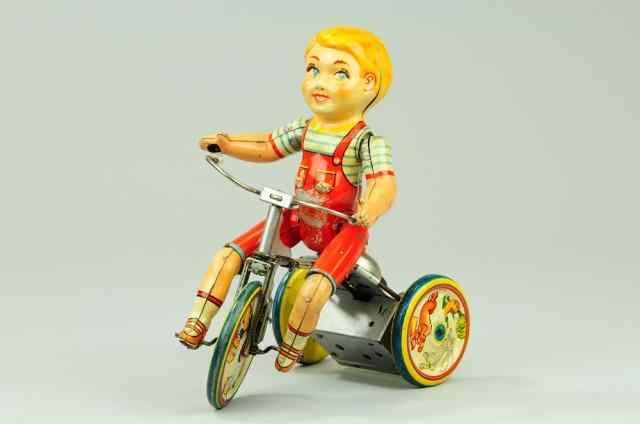 Appraisal: KIDDY CYCLIST Unique Art lithographed tin familiar three-wheeler w seated