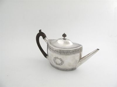 Appraisal: A George III bright engraved oval teapot with a domed