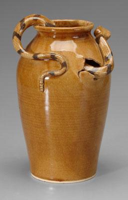 Appraisal: Stoneware jug light honey-colored alkaline glaze applied snake breaking through