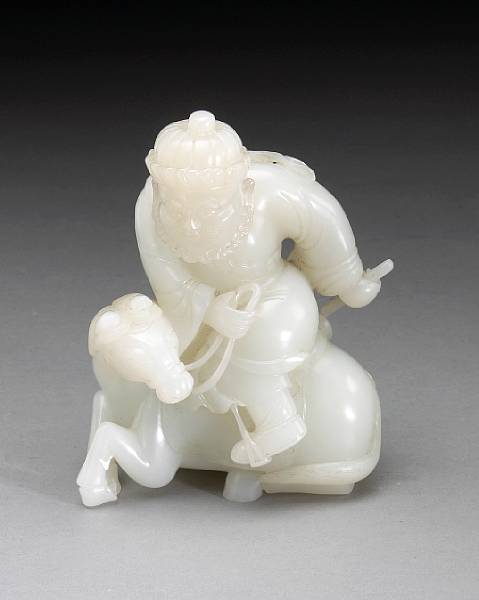 Appraisal: A carved white jade figure of a Central Asian horseman