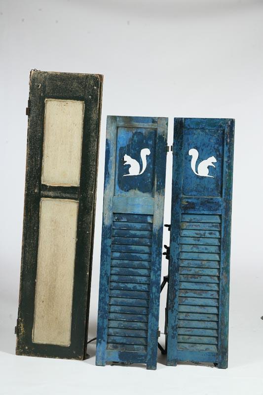 Appraisal: THREE PAINTED SHUTTERS American th- th century Includes a pair