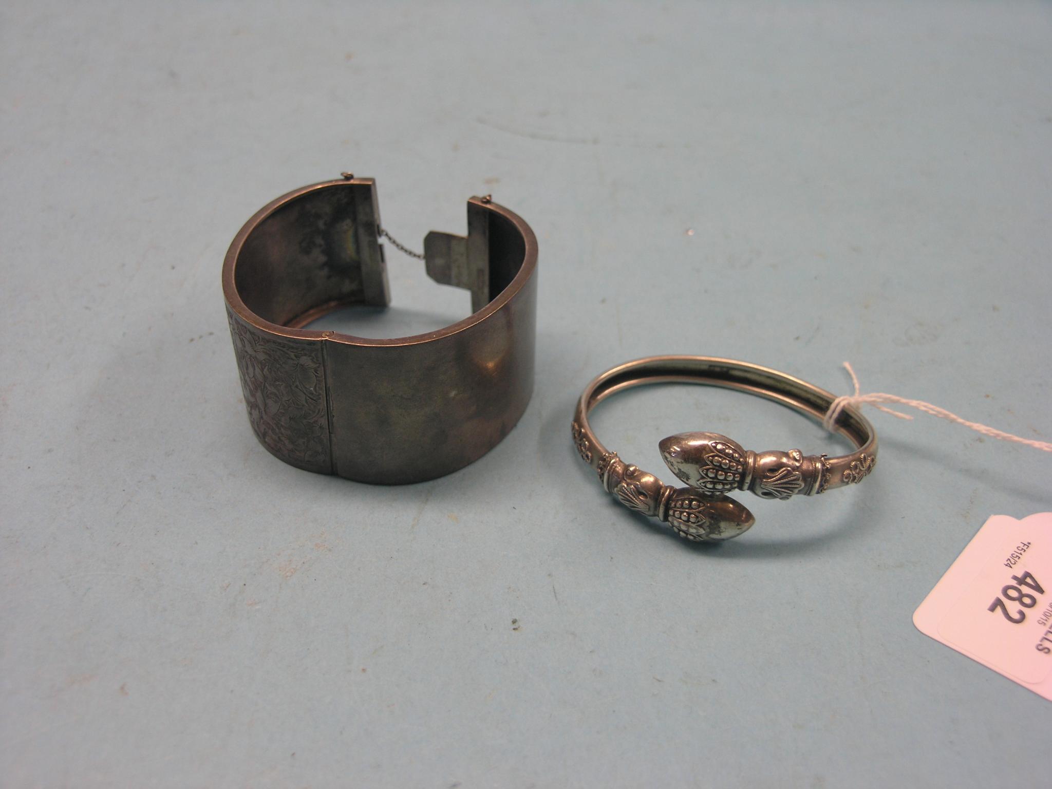 Appraisal: A Victorian white metal bangle and an engraved white metal