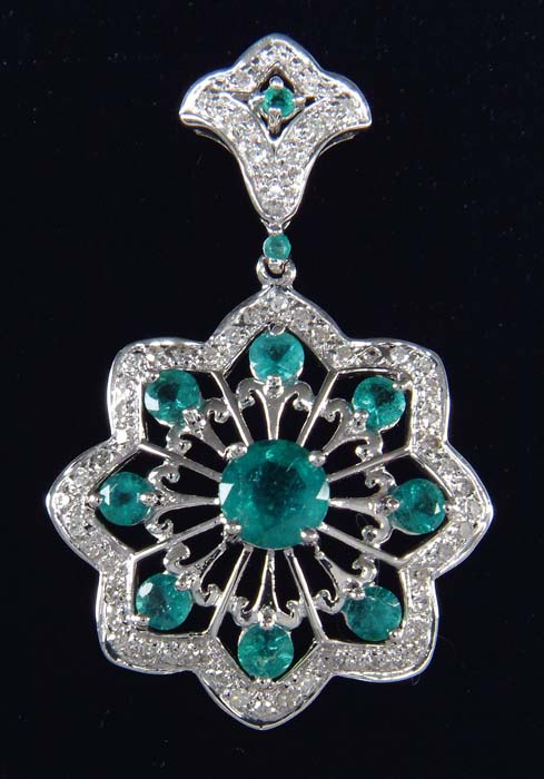 Appraisal: EMERALD DIAMOND PENDANT Elegant kt white gold eight-point pendant has