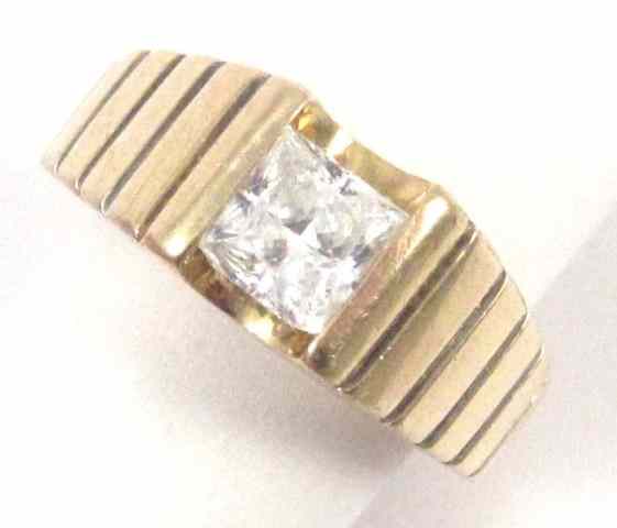 Appraisal: MAN'S FOURTEEN KARAT GOLD RING set with a princess-cut faux