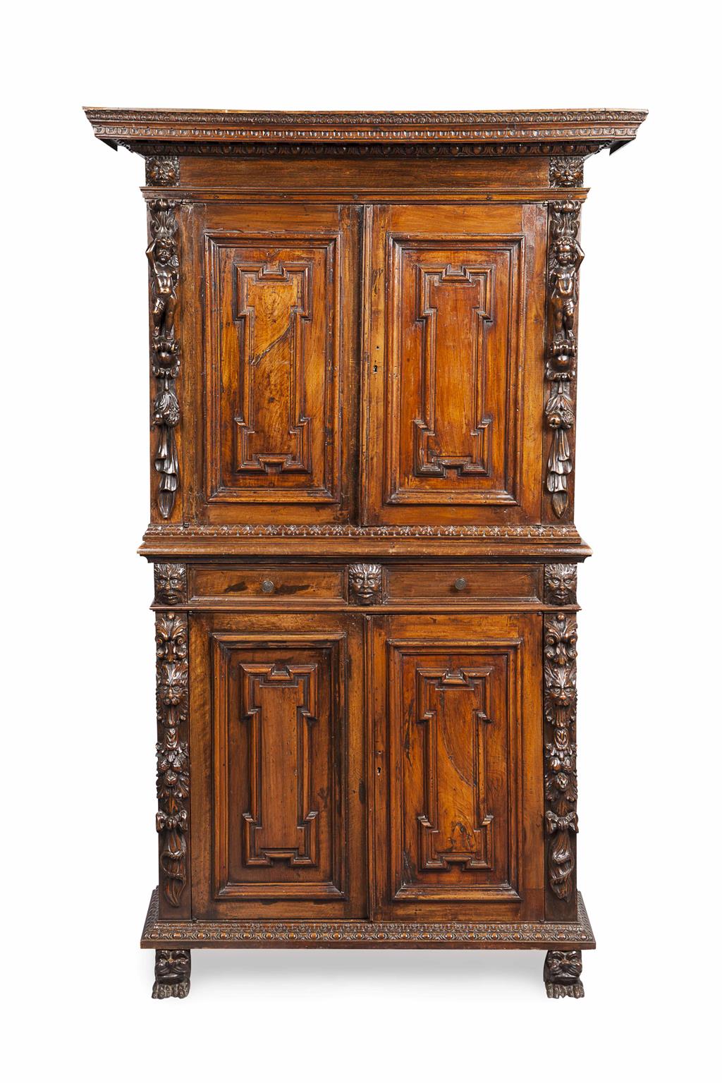 Appraisal: CONTINENTAL CARVED CHESTNUT AND WALNUT CUPBOARD TH CENTURY the projecting