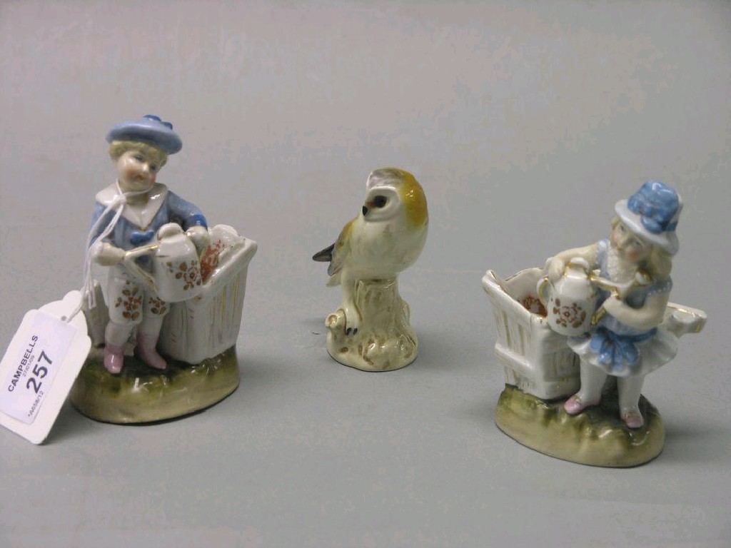 Appraisal: A pair of German porcelain figures boy and girl each