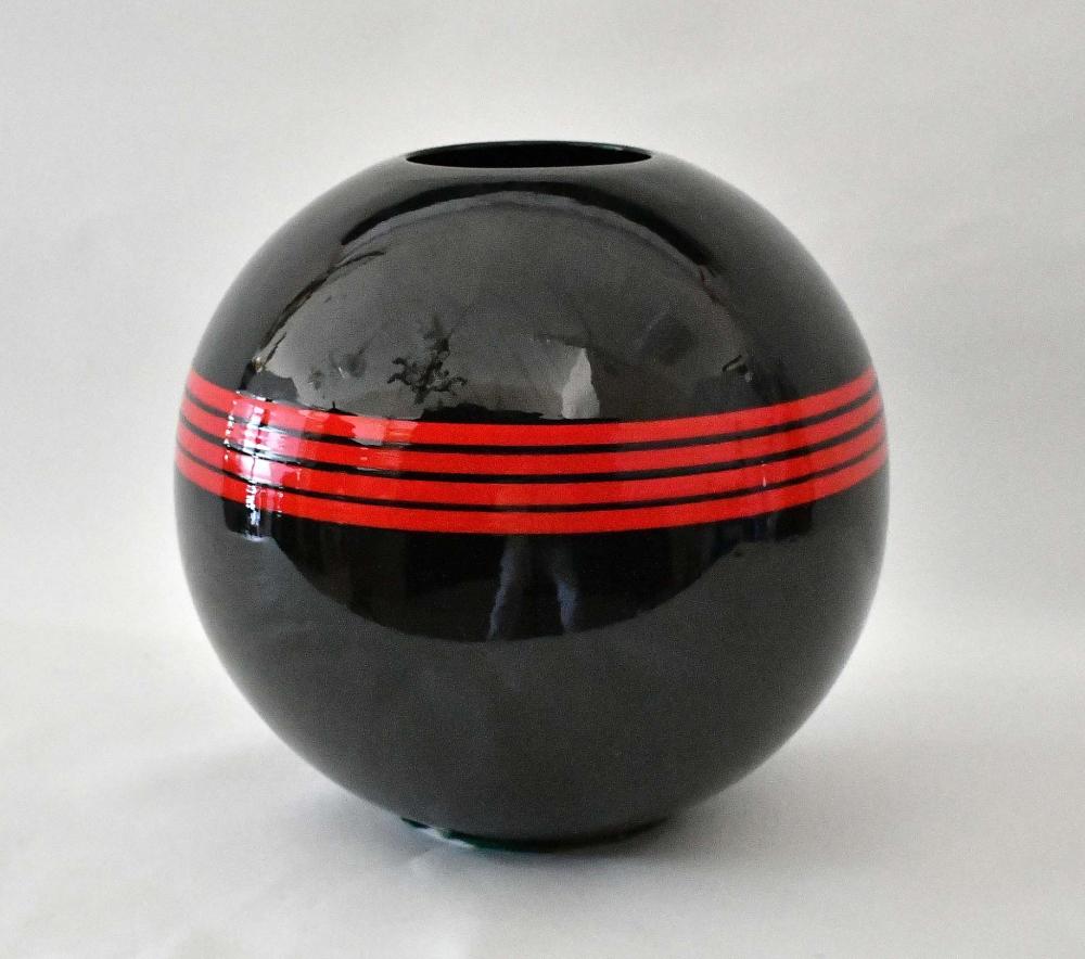 Appraisal: STUDIO CERAMIC BLACK SPHERICAL VASEWith red bands Height in Diameter