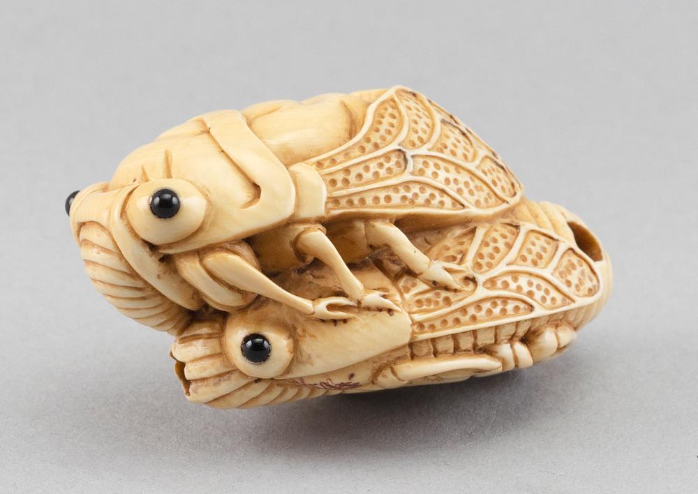 Appraisal: JAPANESE CARVED IVORY NETSUKE BY YAMADA HOJITSU TH CENTURY LENGTH