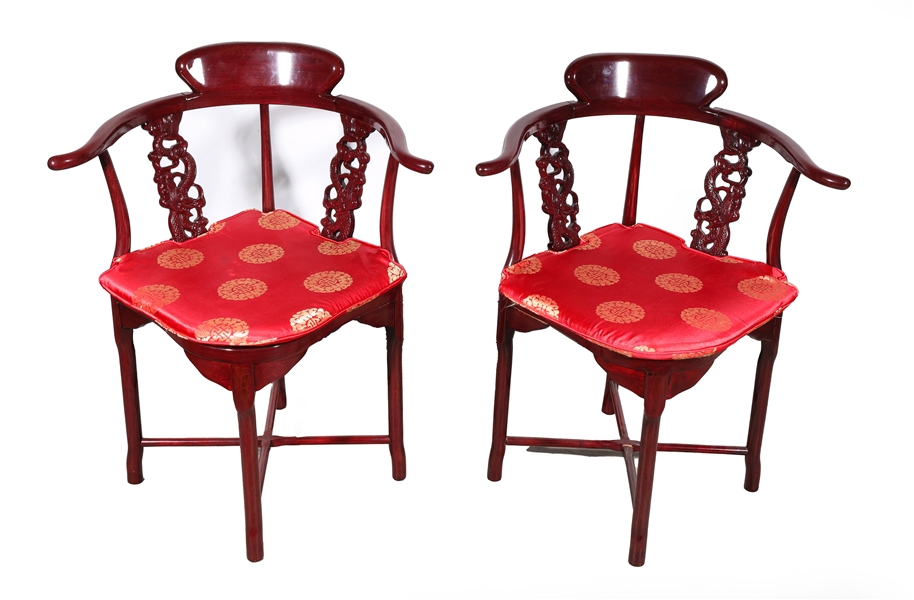 Appraisal: Pair of Chinese mahogany finish wishbone chairs with openwork dragon