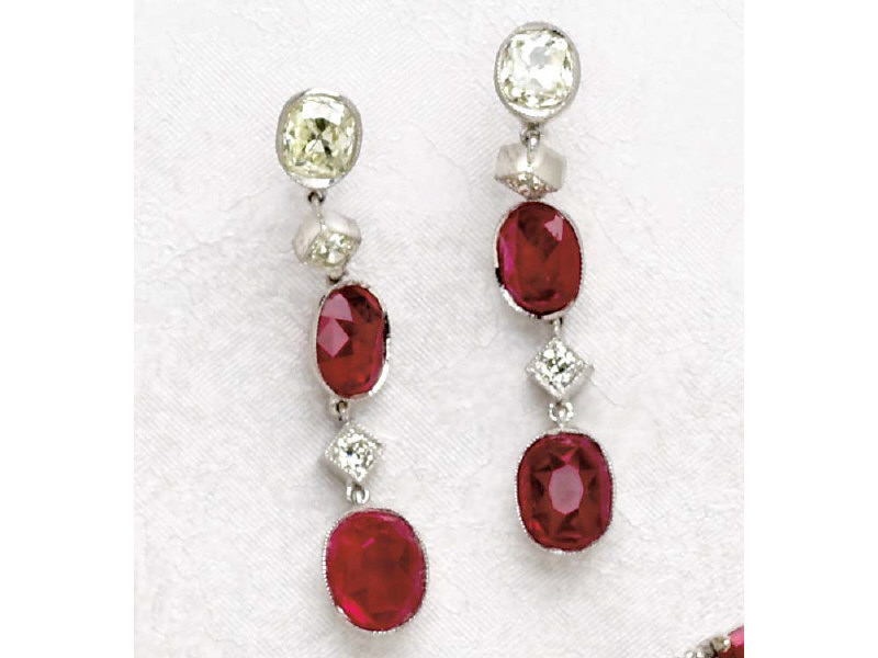 Appraisal: RUBY EARRINGS k white gold dangling earrings set with four