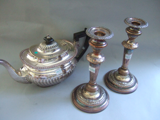 Appraisal: A pair of plated on copper table candlesticks with decorated