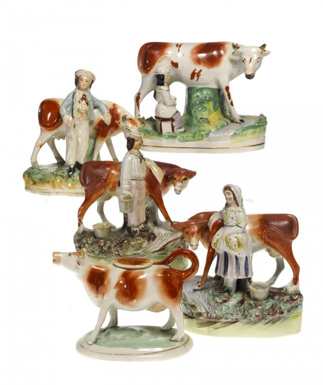 Appraisal: A PAIR OF STAFFORDSHIRE FIGURES OF A FARMER AND HIS