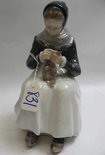 Appraisal: A ROYAL COPENHAGEN GLAZED PORCELAIN FIGURE of a young seated