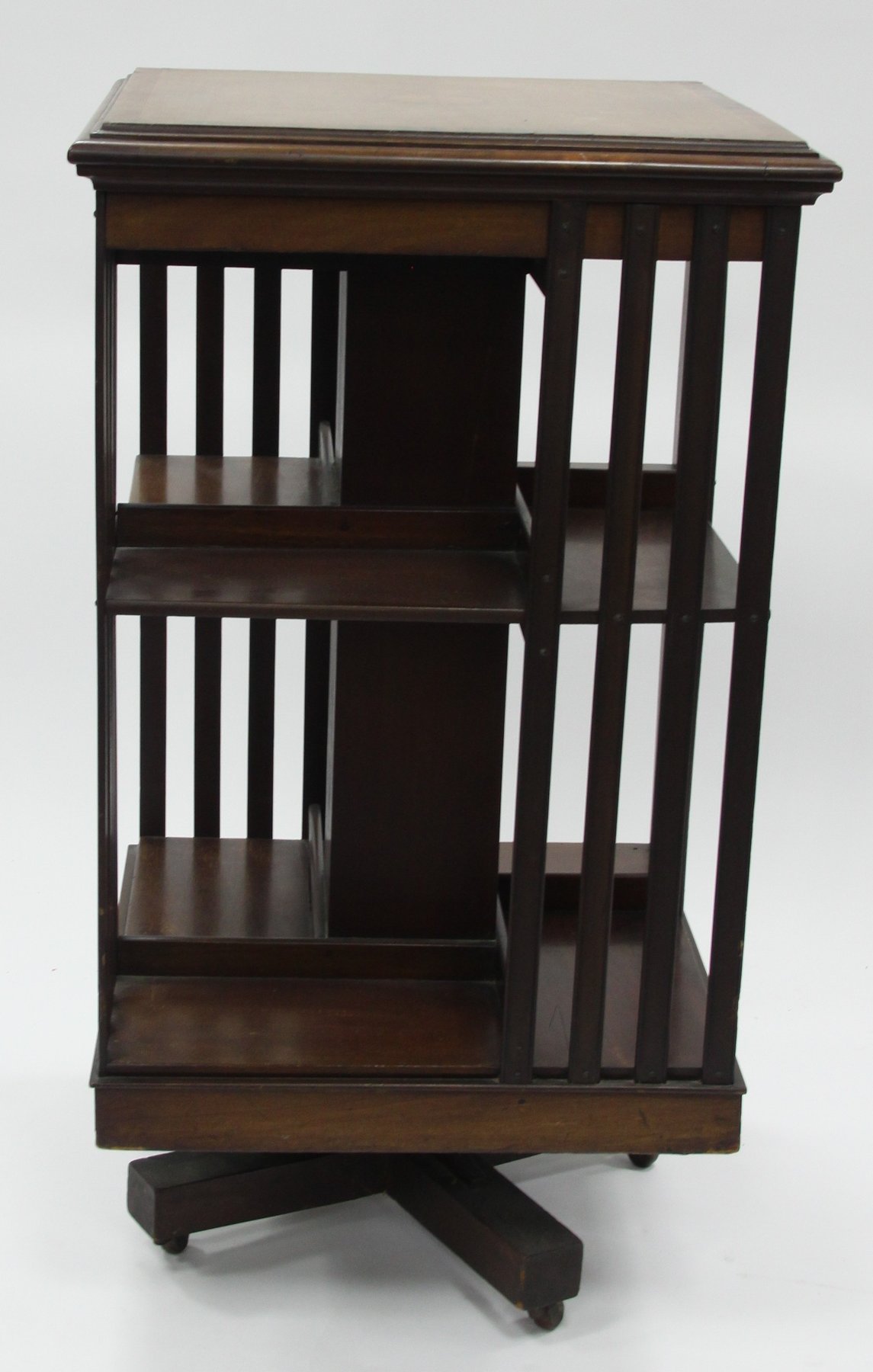 Appraisal: An Edwardian mahogany revolving bookcase with slatted sides cm wide