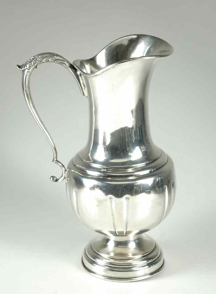 Appraisal: MEXICO STERLING SILVER PITCHER with pedestal base upper handle decorated