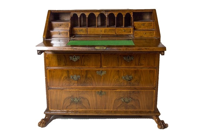 Appraisal: A George I walnut bureau the stepped and welled interior