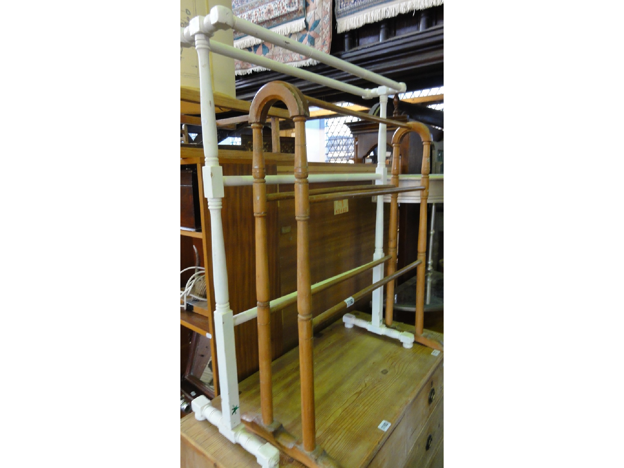 Appraisal: A vintage painted pine free standing towel rail with turned