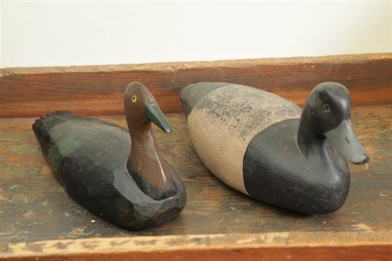 Appraisal: TWO DUCK DECOYS One carved and painted duck decoy with