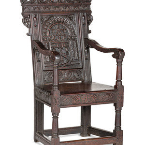 Appraisal: An English Carved Oak and Elm Panel-Back Armchair th Century