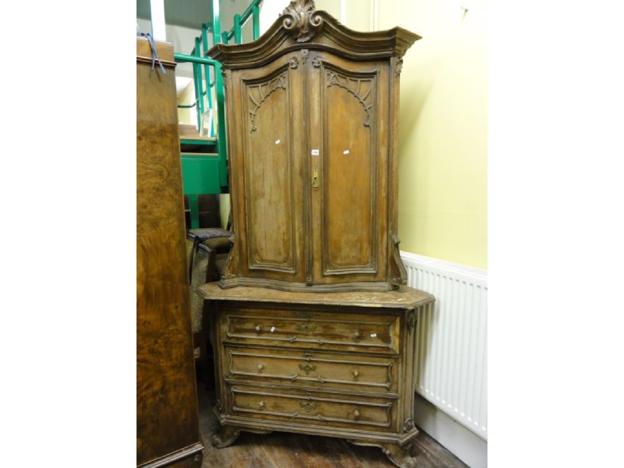 Appraisal: A th century continental pine freestanding corner cupboard the lower