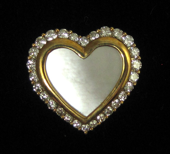 Appraisal: DIAMOND AND MOTHER-OF-PEARL HEART PENDANT k yellow gold having round-cut