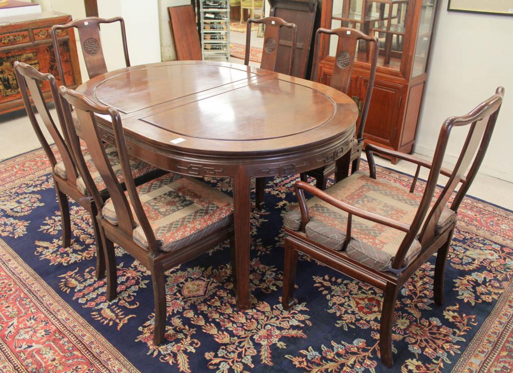 Appraisal: CHINESE ROSEWOOD DINING TABLE AND CHAIR SET oval dining table