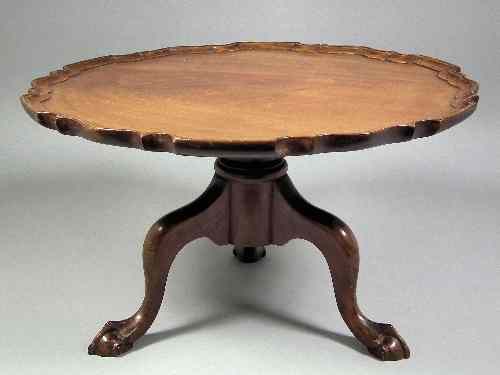 Appraisal: A mahogany ''Lazy Susan'' with shaped tray on tripod base