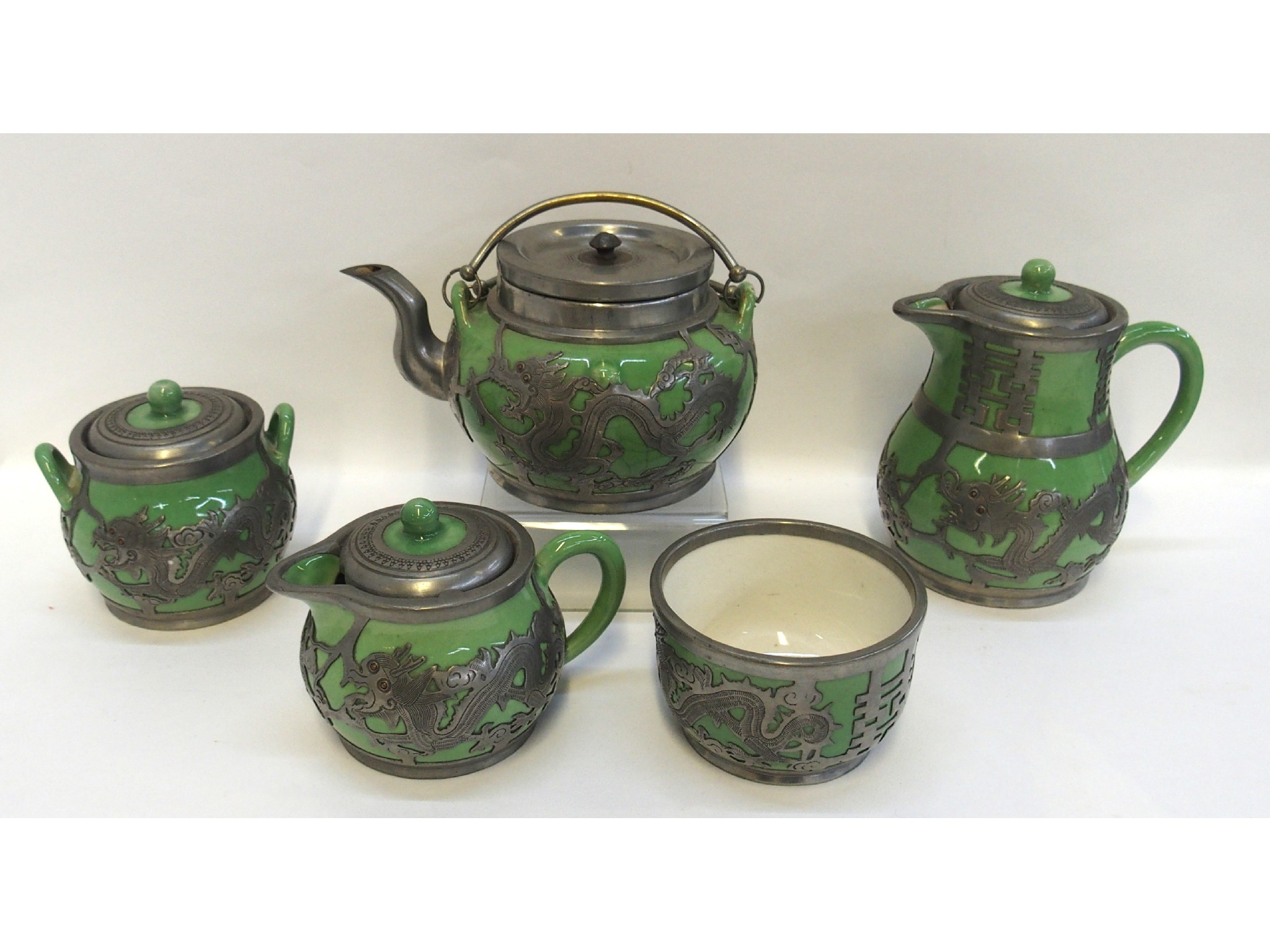 Appraisal: Chinese green glazed five piece teaset with pewter dragon overlay