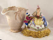 Appraisal: A ceramic group of a lady with a black servant