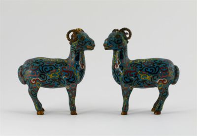 Appraisal: A pair of cloisonn models of standing rams decorated with